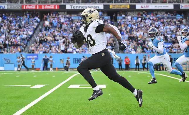 New Orleans Saints running back Audric Estime (30) carries for a touchdown against the Tennessee Titans in the second half of an NFL football game, Sunday, Dec. 28, 2025, in Nashville, Tenn. (AP Photo/John Amis)