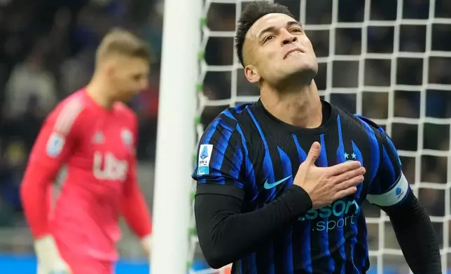 Inter Milan's Lautaro Martinez celebrates after scoring his side's first goal during a Serie A soccer match between Inter and Como, in Milan, Italy, Saturday, Dec. 6, 2025. (AP Photo/Luca Bruno)