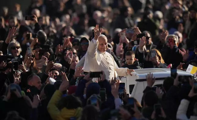 Pope Leo XIV arrives in St. Peter's Square on the occasion of the weekly general audience, at the Vatican, Wednesday, Dec. 10, 2025. (AP Photo/Andrew Medichini)