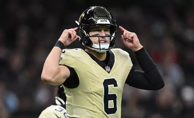 New Orleans Saints quarterback Tyler Shough makes a call during the first half of an NFL football game against the New York Jets, Sunday, Dec. 21, 2025, in New Orleans. (AP Photo/Ella Hall)