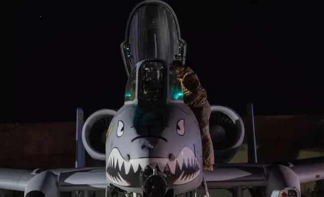 This photo provided by the U.S. Air Force shows a U.S. Airman preparing an A-10 Thunderbolt II for flight from a base in the U.S. Central Command area of responsibility, Friday, Dec. 19, 2025, in support of Operation Hawkeye Strike. (U.S. Air Force/DVIDS via AP)