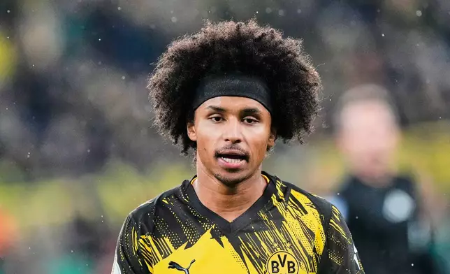 Dortmund's Karim Adeyemi reacts during the German Soccer Cup round of sixteen soccer match between Borussia Dortmund and Bayer 04 Leverkusen in Dortmund, Germany, Tuesday, Dec. 2, 2025. (AP Photo/Martin Meissner)