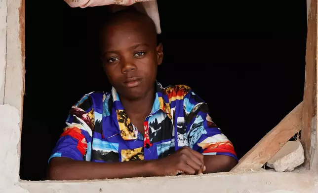Onyeka Chieme, a student of St. Mary's Catholic School, abducted by gunmen and later released, poses for a photograph at his house in Papiri, Nigeria, Wednesday, Dec. 10, 2025. (AP Photo/Afolabi Sotunde)
