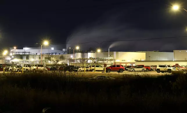 Steam rises from chimneys during the night shift at the Tyson Foods' beef plant in Lexington, Neb., Wednesday, Dec. 3, 2025. (AP Photo/Thomas Peipert)