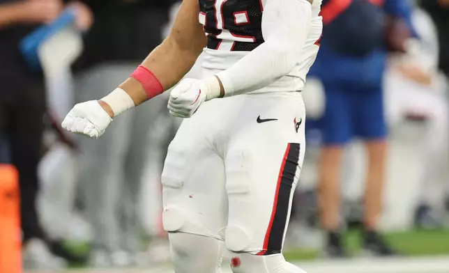 Houston Texans linebacker Henry To'Oto'O (39) celebrates after sacking Los Angeles Chargers quarterback Justin Herbert during the second half of an NFL football game Saturday, Dec. 27, 2025, in Inglewood, Calif. (AP Photo/Kevork Djansezian)
