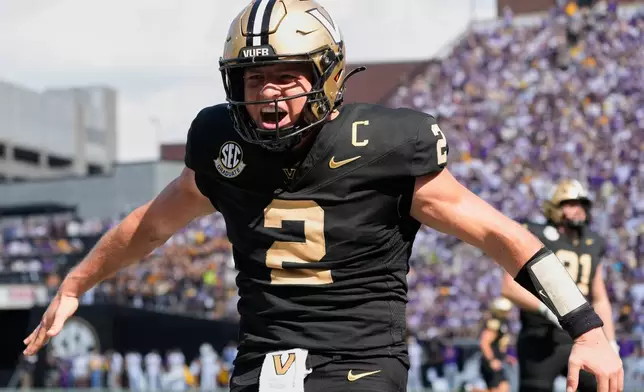 FILE - Vanderbilt quarterback Diego Pavia (2) celebrates a touchdown during the second half of an NCAA college football game against LSU, Saturday, Oct. 18, 2025, in Nashville, Tenn. (AP Photo/George Walker IV, File)