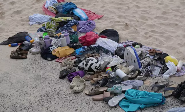 Belongings sit piled up after a shooting the day prior at Sydney's Bondi Beach, Monday, Dec. 15, 2025. (AP Photo/Mark Baker)