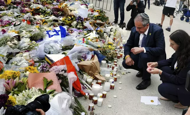 Israeli Ambassador to Australia Amir Maimon, pauses to pay his respects at a floral memorial at the Bondi Pavilion at Bondi Beach on Tuesday, Dec. 16, 2025, following Sunday's shooting in Sydney, Australia. (AP Photo/Mark Baker)