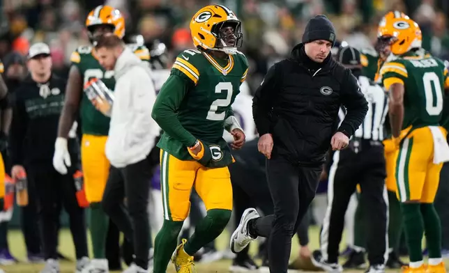 Green Bay Packers quarterback Malik Willis (2) leaves the field after an apparent injury during the second half of an NFL football game against the Baltimore Ravens, Saturday, Dec. 27, 2025, in Green Bay, Wis. (AP Photo/Morry Gash)