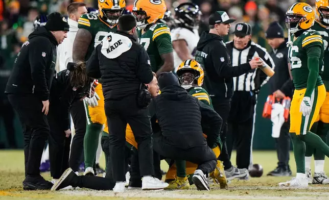 Green Bay Packers quarterback Malik Willis reacts after an apparent injury during the second half of an NFL football game against the Baltimore Ravens, Saturday, Dec. 27, 2025, in Green Bay, Wis. (AP Photo/Morry Gash)