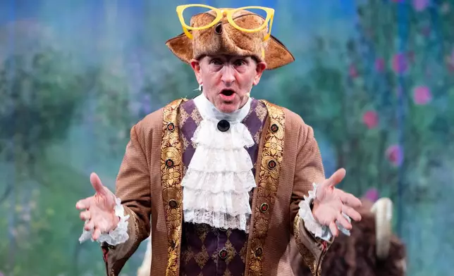 Michael Edwards, better known as Eddie the Eaglen plays Professor Crackpot in the pantomime "Beauty and the Beast" at Watersmeet Theatre, in Rickmansworth, England, Dec. 5, 2025. (AP Photo/Thomas Krych)