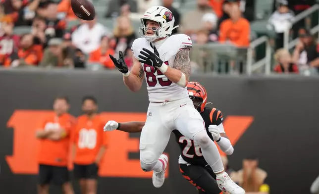 Arizona Cardinals tight end Trey McBride (85) catches a touchdown pass in the endzone during the second half of an NFL football game against the Cincinnati Bengals, Sunday, Dec. 28, 2025, in Cincinnati. (AP Photo/Joshua A. Bickel)