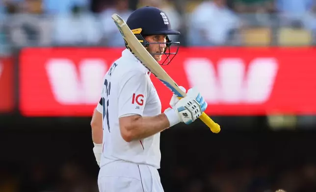 England's Joe Root celebrates his fifty runs during the second Ashes cricket test match between Australia and England in Brisbane, Thursday, Dec. 4, 2025.. (AP Photo/Tertius Pickard)