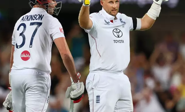 England's Joe Root celebrates his century during the second Ashes cricket test match between Australia and England in Brisbane, Thursday, Dec. 4, 2025.. (AP Photo/Tertius Pickard)