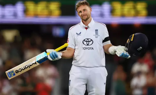 England's Joe Root celebrates his century during the second Ashes cricket test match between Australia and England in Brisbane, Thursday, Dec. 4, 2025.. (AP Photo/Tertius Pickard)
