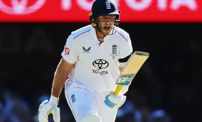 England's Joe Root reacts after miss a delivery during the second Ashes cricket test match between Australia and England in Brisbane, Thursday, Dec. 4, 2025.. (AP Photo/Tertius Pickard)