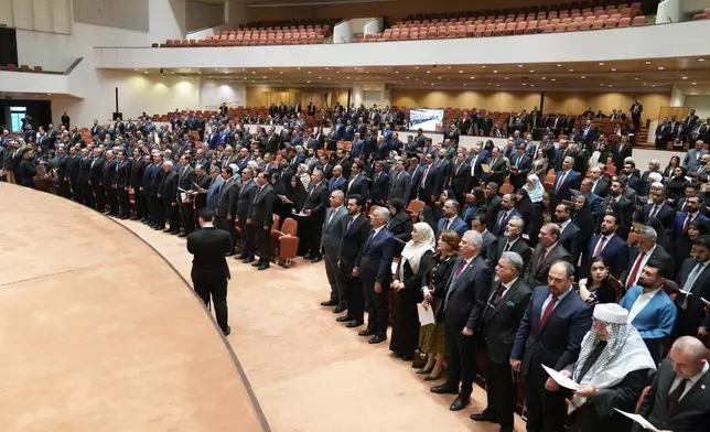 Newly elected lawmakers attend the first parliament session, in Baghdad, Iraq, Monday, Dec. 29, 2025. (Iraqi Parliament Media Office via AP)