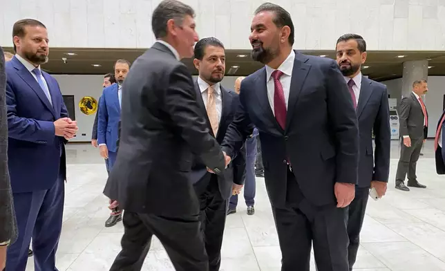 Members of the new Iraqi Parliament are seen before the start of their first legislative session in Baghdad, Iraq, Monday, Dec. 29, 2025. (AP Photo/Hadi Mizban)