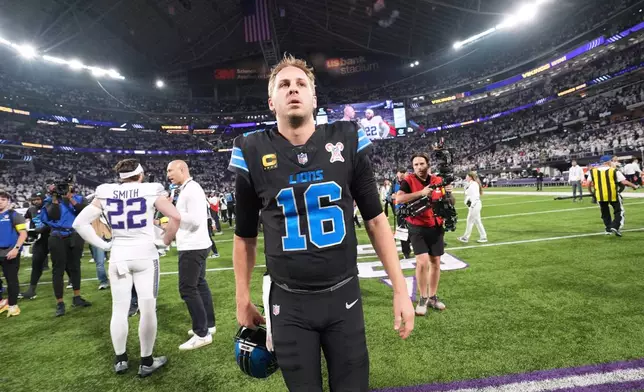 Detroit Lions quarterback Jared Goff walks off the field after the team's loss to the Minnesota Vikings in an NFL football game, Thursday, Dec. 25, 2025, in Minneapolis. (AP Photo/Abbie Parr)