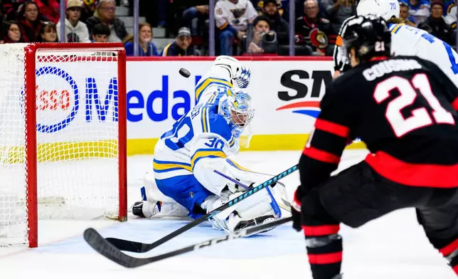 St. Louis Blues goaltender Joel Hofer (30) makes a save during second-period NHL hockey game action against the Ottawa Senators in Ottawa, Ontario, Saturday, Dec. 6, 2025. (Spencer Colby/The Canadian Press via AP)