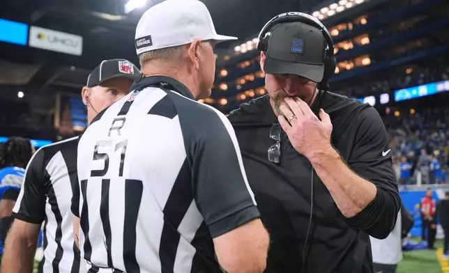 Detroit Lions head coach Dan Campbell talks with officials after the final play of an NFL football game against the Pittsburgh Steelers, Sunday, Dec. 21, 2025, in Detroit. (AP Photo/Ryan Sun)