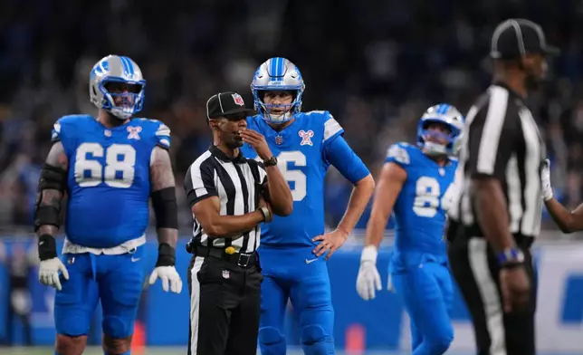 Detroit Lions' Jared Goff (16) waits for a call on the final play of an NFL football game against the Pittsburgh Steelers, Sunday, Dec. 21, 2025, in Detroit. (AP Photo/Ryan Sun)