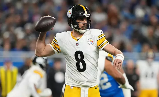 Pittsburgh Steelers' Aaron Rodgers passes during the first half of an NFL football game against the Detroit Lions, Sunday, Dec. 21, 2025, in Detroit. (AP Photo/Ryan Sun)