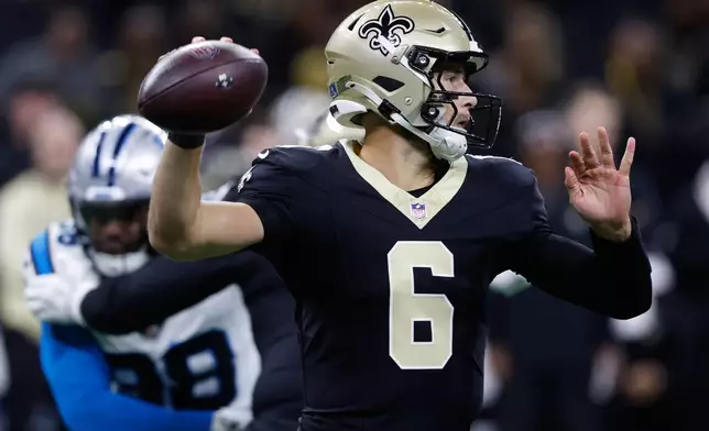 New Orleans Saints quarterback Tyler Shough (6) throws a pass in the first half of an NFL football game against the Carolina Panthers, Sunday, Dec. 14, 2025, in New Orleans. (AP Photo/Butch Dill)