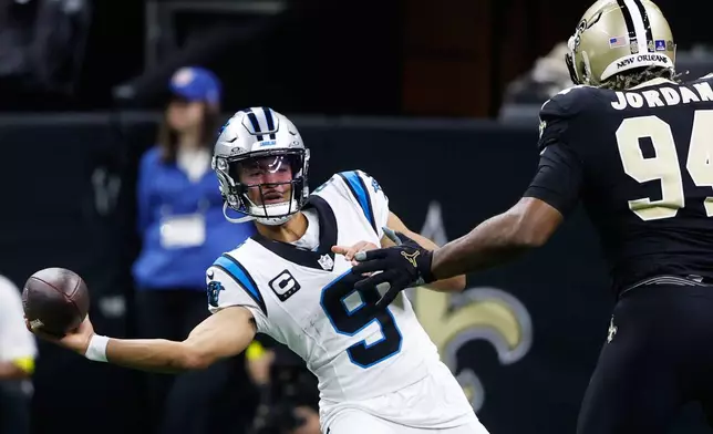 Carolina Panthers quarterback Bryce Young (9) completes a pass in the first half of an NFL football game against the New Orleans Saints, Sunday, Dec. 14, 2025, in New Orleans. (AP Photo/Butch Dill)