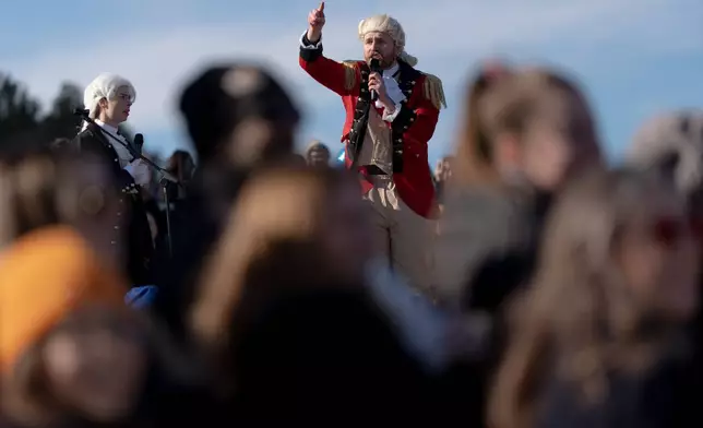 A person dressed as George Washington speaks at a mock funeral for the penny, which was discontinued earlier this year, Saturday, Dec. 20, 2025, in front of the Lincoln Memorial in Washington. (AP Photo/Julia Demaree Nikhinson)