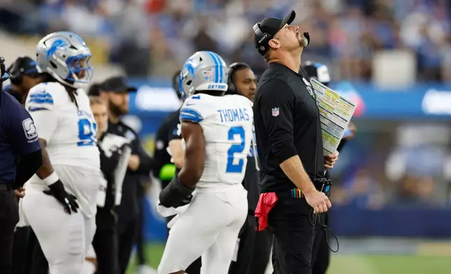 Detroit Lions head coach Dan Campbell looks up at the scoreboard during the second half of an NFL football game against the Los Angeles Rams, Sunday, Dec. 14, 2025, in Inglewood, Calif. (AP Photo/Caroline Brehman)