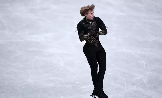 Ilia Malinin, of the United States, competes in the men's free skating segment at the ISU Grand Prix of Figure Skating Final in Nagoya, central Japan, Saturday, Dec. 6, 2025. (AP Photo/Hiro Komae)