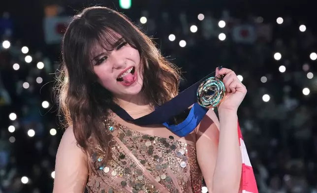 Alysa Liu, of the United States, poses after winning the gold medal in the women's event at the ISU Grand Prix of Figure Skating Final in Nagoya, central Japan, Saturday, Dec. 6, 2025. (AP Photo/Hiro Komae)