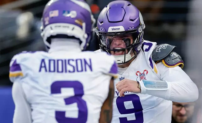 Minnesota Vikings quarterback J.J. McCarthy (9) celebrates after scoring a touchdown against the New York Giants during the second quarter of an NFL football game, Sunday, Dec. 21, 2025, in East Rutherford, N.J. (AP Photo/Adam Hunger)