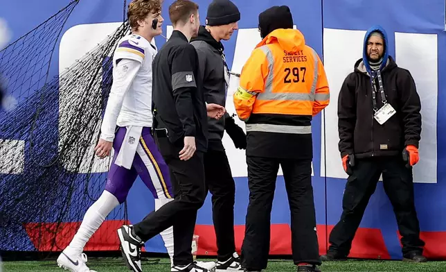 Minnesota Vikings quarterback J.J. McCarthy (9) leaves the game near the end of the first half of an NFL football game against the New York Giants, Sunday, Dec. 21, 2025, in East Rutherford, N.J. (AP Photo/Adam Hunger)