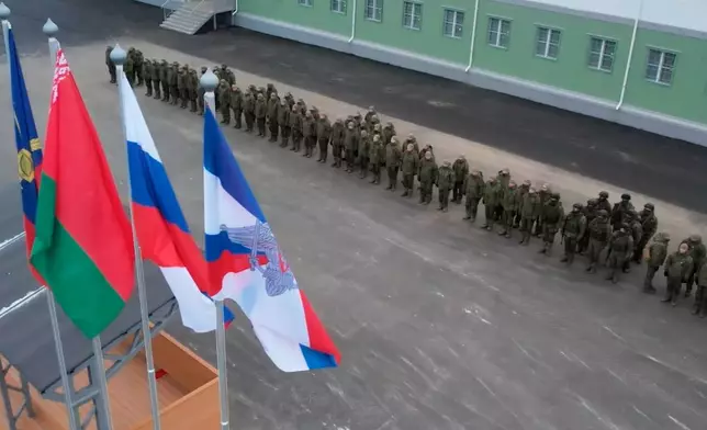 In this image made from video provided by Russian Defense Ministry Press Service on Monday, Dec. 29, 2025, Russian troops line up at a base in Belarus where the Oreshnik missile system was deployed in Belarus. (Russian Defense Ministry Press Service via AP)