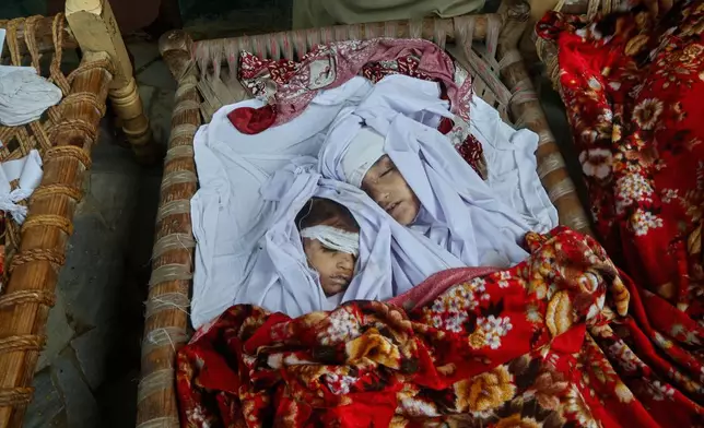 Bodies of children killed in flash flooding lie at a home Aug. 16, 2025, near Pir Baba, Buner district, Pakistan. (AP Photo/Muhammad Sajjad, File)