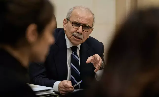 Lebanese Prime Minister Nawaf Salam meets with journalists working for foreign media and news agencies at the government palace in Beirut, Wednesday, Dec. 3, 2025. (AP Photo/Bilal Hussein)