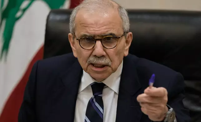 Lebanese Prime Minister Nawaf Salam speaks to journalists working for foreign media and news agencies at the government palace in Beirut, Wednesday, Dec. 3, 2025. (AP Photo/Bilal Hussein)