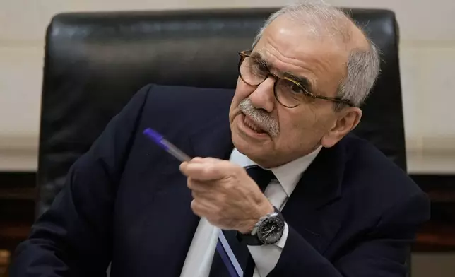 Lebanese Prime Minister Nawaf Salam speaks to journalists working for foreign media and news agencies at the government palace in Beirut, Wednesday, Dec. 3, 2025. (AP Photo/Bilal Hussein)