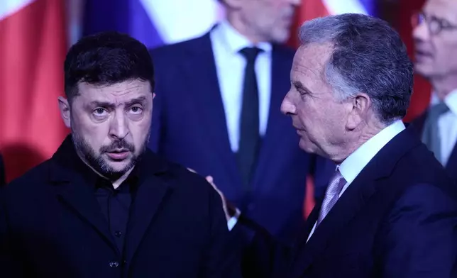 Ukraine's President Volodymyr Zelenskyy, left, and Steve Witkoff, special envoy of the United States, meet at the chancellery in Berlin, Germany, Monday, Dec. 15, 2025. (AP Photo/Markus Schreiber, Pool)