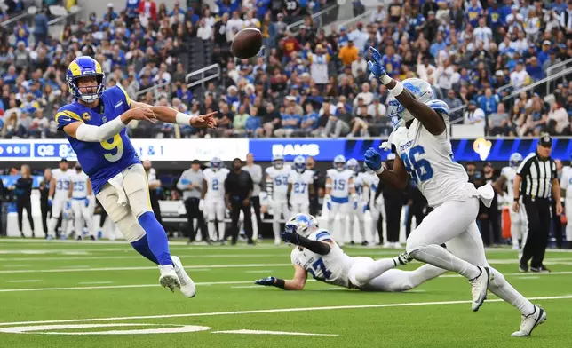 Los Angeles Rams quarterback Matthew Stafford (9) throws a pass during the first half of an NFL football game against the Detroit Lions, Sunday, Dec. 14, 2025, in Inglewood, Calif. (AP Photo/Katie Chin)