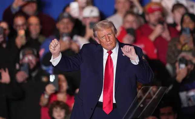 President Donald Trump dances to music after speaking at the Mount Airy Casino Resort in Mount Pocono, Pa., Tuesday, Dec. 9, 2025. (AP Photo/Matt Rourke)