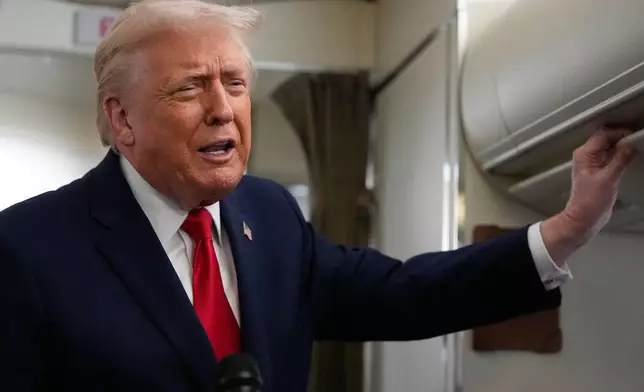 President Donald Trump speaks with reporters while in flight on Air Force One from Joint Base Andrews to Avoca, Pa., Tuesday, Dec. 9, 2025. (AP Photo/Alex Brandon)