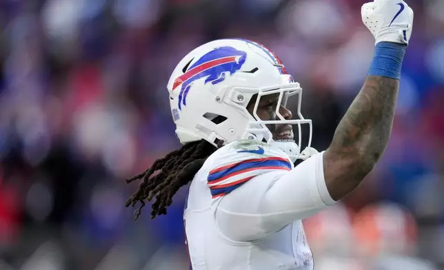 Buffalo Bills running back James Cook III celebrates his touchdown against the Cleveland Browns during the first half of an NFL football game in Cleveland, Sunday, Dec. 21, 2025. (AP Photo/Sue Ogrocki)