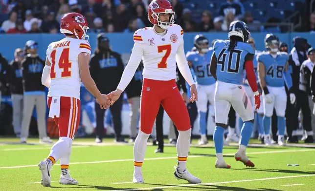 Kansas City Chiefs place-kicker Harrison Butker (7) celebrates with punter Matt Araiza (14) after kicking a field goal during the first half of an NFL football game against the Tennessee Titans, Sunday, Dec. 21, 2025, in Nashville, Tenn. (AP Photo/John Amis)