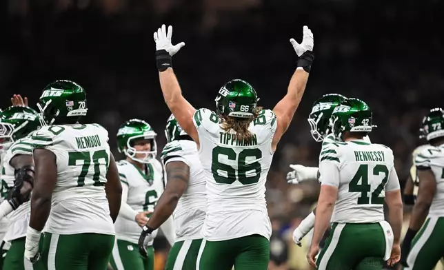 New York Jets guard Joe Tippmann (66) celebrates after a field goal during the first half of an NFL football game against the New Orleans Saints, Sunday, Dec. 21, 2025, in New Orleans. (AP Photo/Ella Hall)