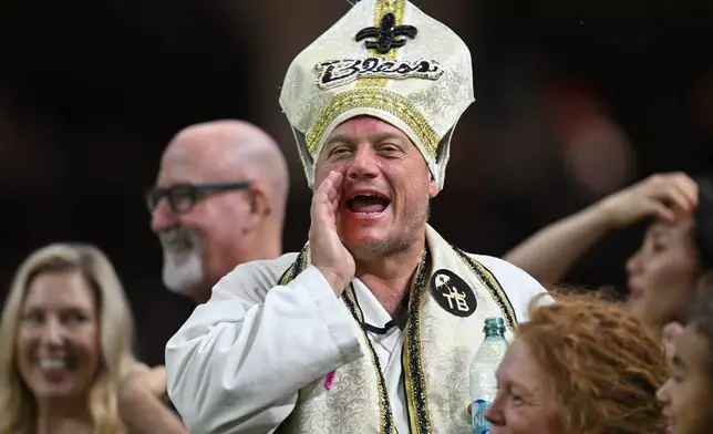 A New Orleans Saints fan yells during the first half of an NFL football game against the New York Jets, Sunday, Dec. 21, 2025, in New Orleans. (AP Photo/Ella Hall)