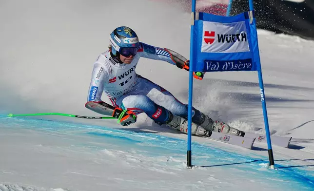 Norway's Timon Haugan speeds down the course during an alpine ski, men's World Cup giant slalom event, in Val d'Isere, France, Saturday Dec. 13, 2025. (AP Photo/Pier Marco Tacca)