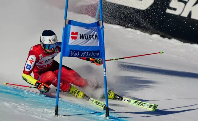 Austria's Stefan Brennsteiner speeds down the course during an alpine ski, men's World Cup giant slalom event, in Val d'Isere, France, Saturday Dec. 13, 2025. (AP Photo/Pier Marco Tacca)